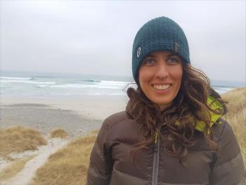 woman in hat by sea