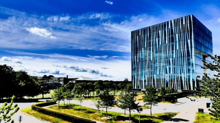 Cube-shaped building of stripy glass