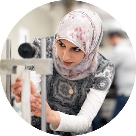 Female student with a microscope