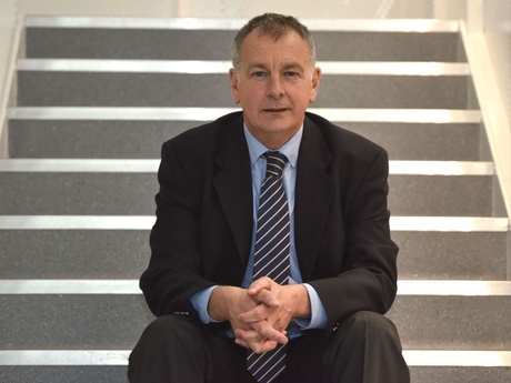 John sitting on a flight of stairs