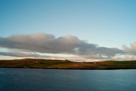 A landscape image of Shetland viewed from offshore